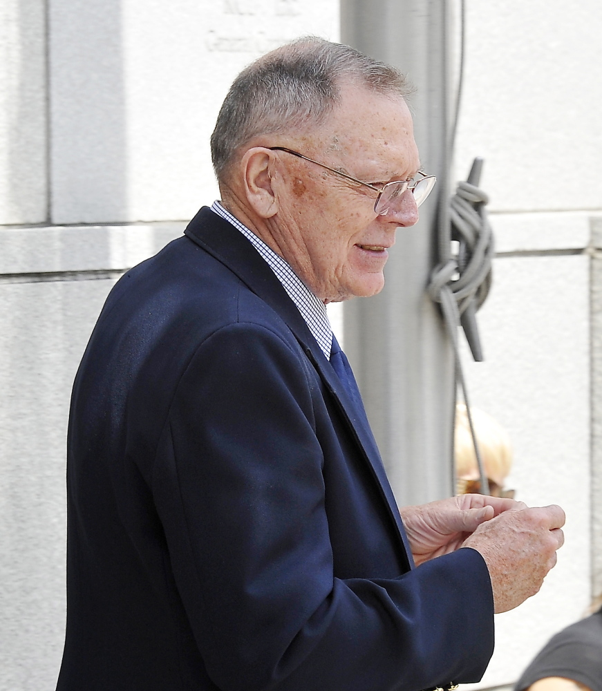 Andrew Demers, who is accused of child molestation, leaves the Cumberland County Courthouse after discussions about his case with attorney Walter McKee. Gordon Chibroski/Staff Photographer