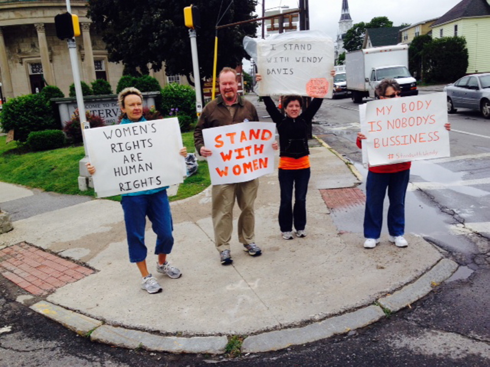 In this file photo, former Waterville Mayor Karen Heck, along with Alan Tibbetts of Sidney; Winslow resident Mindy Bergeron-Lawrence and Penny Rafuse of Waterville demonstrate in support of women’s reproductive rights at the corner of Elm and Main streets in downtown Waterville.