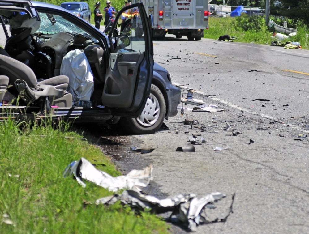 This van on one side of U.S. Route 202, left, and a white car on the other side, top right, were involved in a head-on collision on Friday near TJ’s Place in Monmouth.