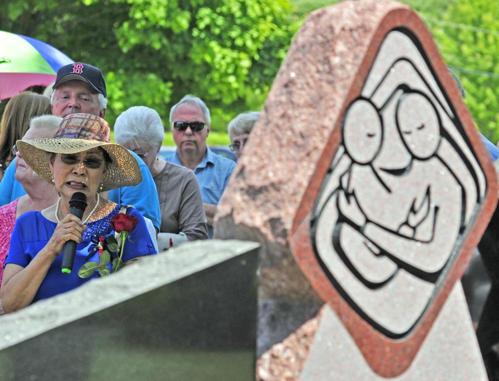 Yong Jones says the name of her late son, Lawrence Jones, during dedication of the Maine Murder Victims’ Memorial Monument on Sunday in Augusta. She and other survivors said aloud the names that were engraved on the monument as part of the ceremony.