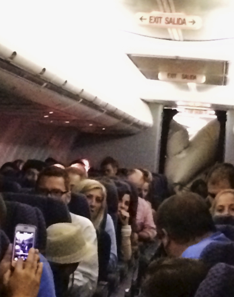 This photo provided by Michael Schroeder shows an emergency chute after it inflated inside a United Airlines plane on Sunday, filling part of the cabin and forcing the pilot to make an emergency landing in Kansas. United officials said no one aboard was injured.