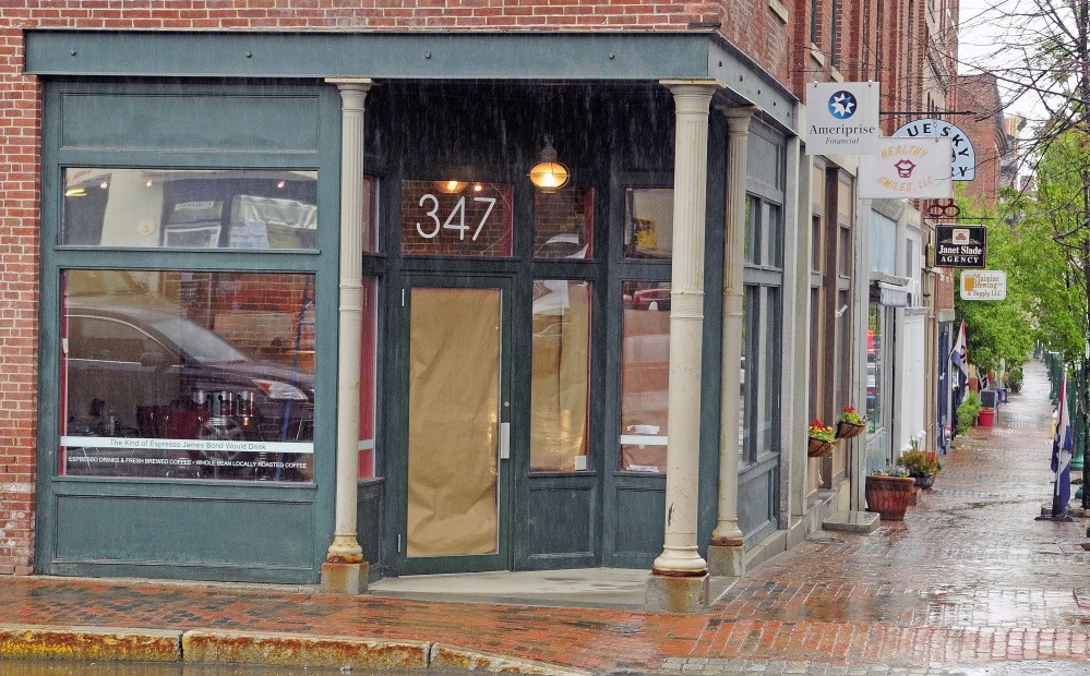 Staff photo by Joe Phelan Opening: The future home of Frosty’s Donuts at 347 Water St. will be painted red and white before the shop opens there later this month.