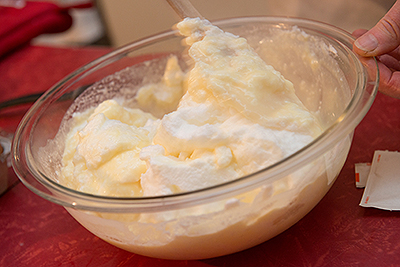 Susan Axelrod prepares Honey-Vanilla Cream with milk and eggs from the farmers market. The two versions of the dessert varied quite a bit in taste, she said.