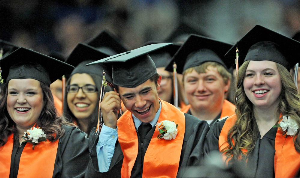 Staff photo by Michael G. Seamans 
 Dillon Pelletier laughs during Winslow High School's  commencement ceremonies at the Alfond Athletic Center at Colby College in Waterville on Wendesday, June 3, 2014.