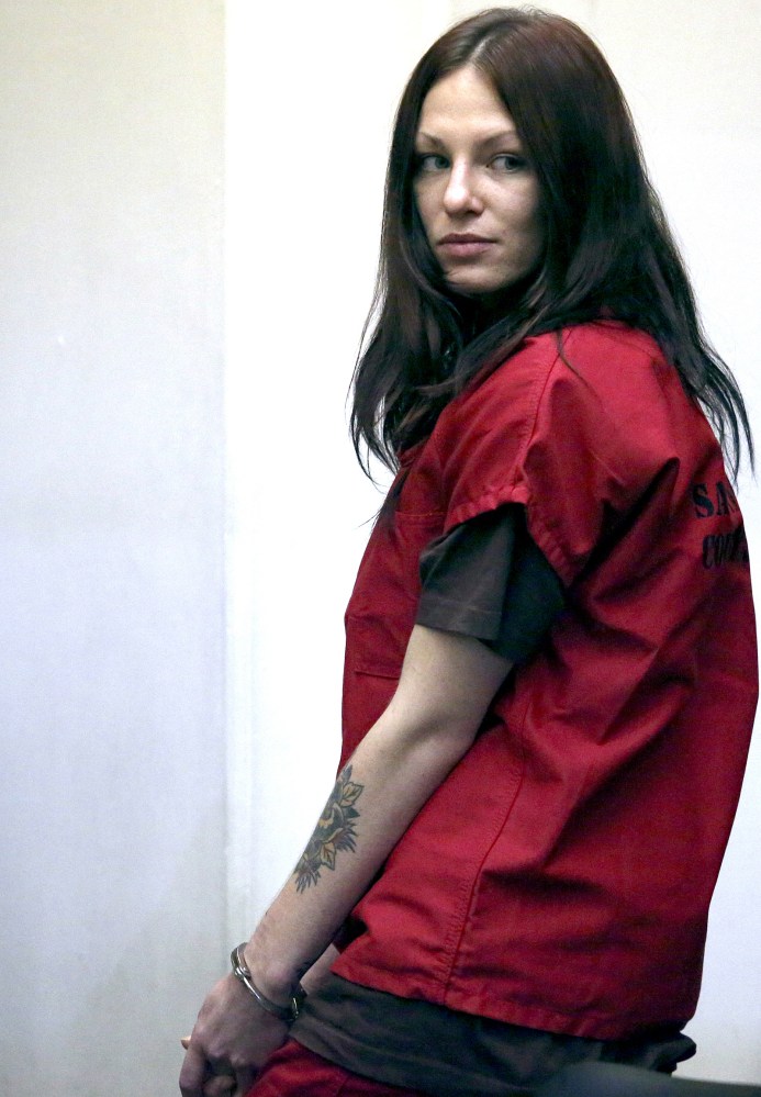 Alix Tichelman looks back toward her family after her arraignment in Santa Cruz County Superior Court on Wednesday. At the hearing, the judge denied Tichelman’s request to be released on her own recognizance and kept her bail at $1.5 million.