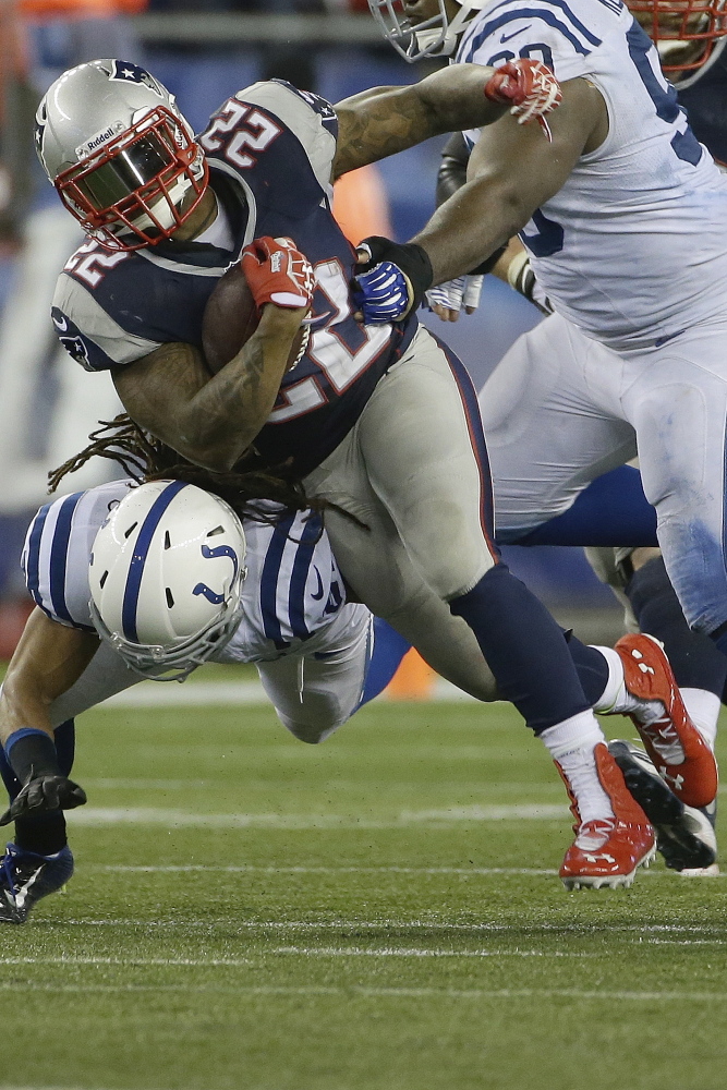 Running back Stevan Ridley (22) had problems fumbling the football last season for the New England Patriots. Whether Ridley has cured his problem and has regained the trust of head coach Bill Belichick is a question to be answered as the Patriots enter training camp this week in Foxborough, Mass.