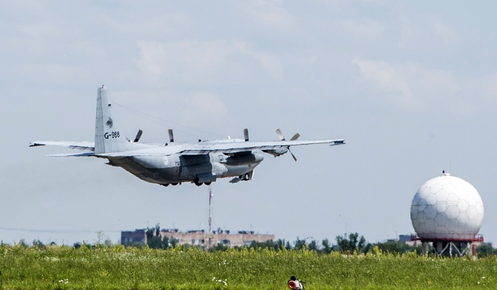 A Dutch cargo plane loaded with coffins holding the bodies of some of the Malaysian Airlines plane passengers, leaves for the Netherlands from Kharkiv airport, Ukraine, Wednesday.