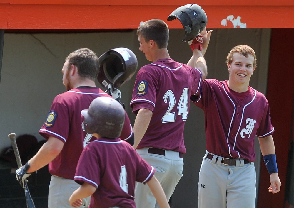 Members of the Franklin County Flyers celebrate after scoring against Gardiner during a Zone 2 playoff game in Skowhegan. The Flyers return to action Saturday to play Westbrook in a state tournament play-in game.
