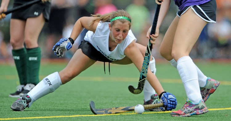 East All Star Ali King, 9, of Old Town, right, battles for the ball with West All Star Alex Staples, 7, of Massabesic, in the annual Senior All Star Game at Thomas College in Waterville on Saturday.