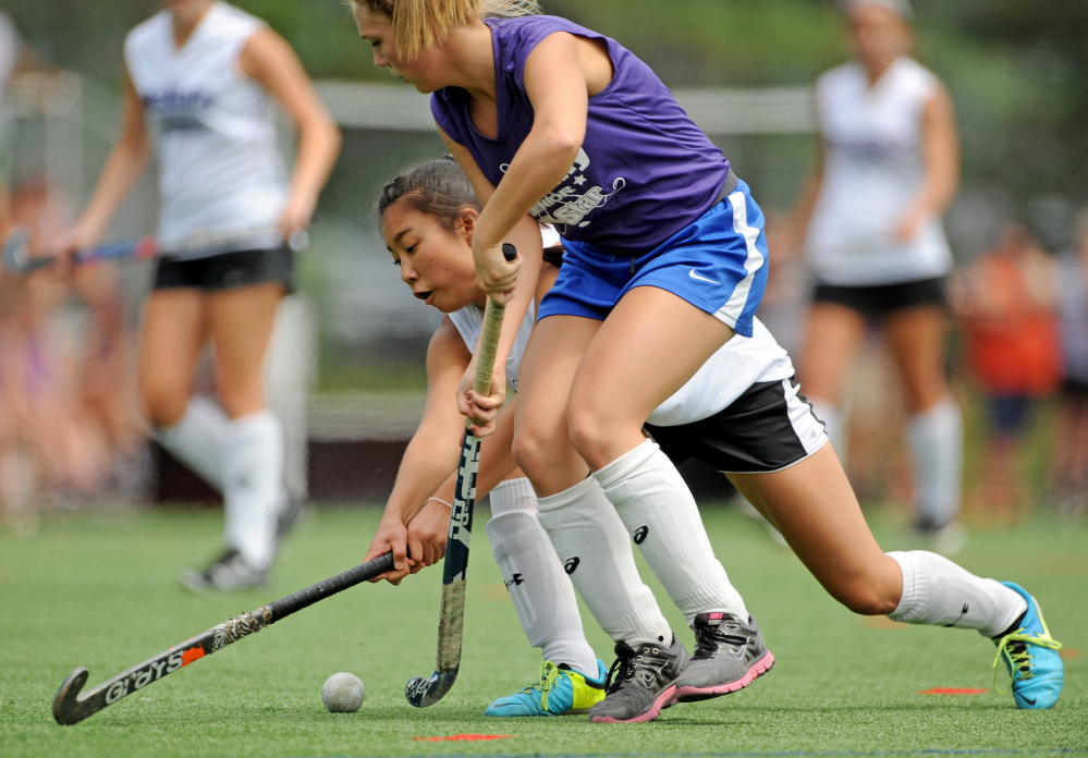 East Senior All Star  Madison Cummings, 10, front, battles for the ball with West Senior All Star Junyoung Shin, 17,  in the annual Senior All Star Game at Thomas College in Waterville on Saturday,.