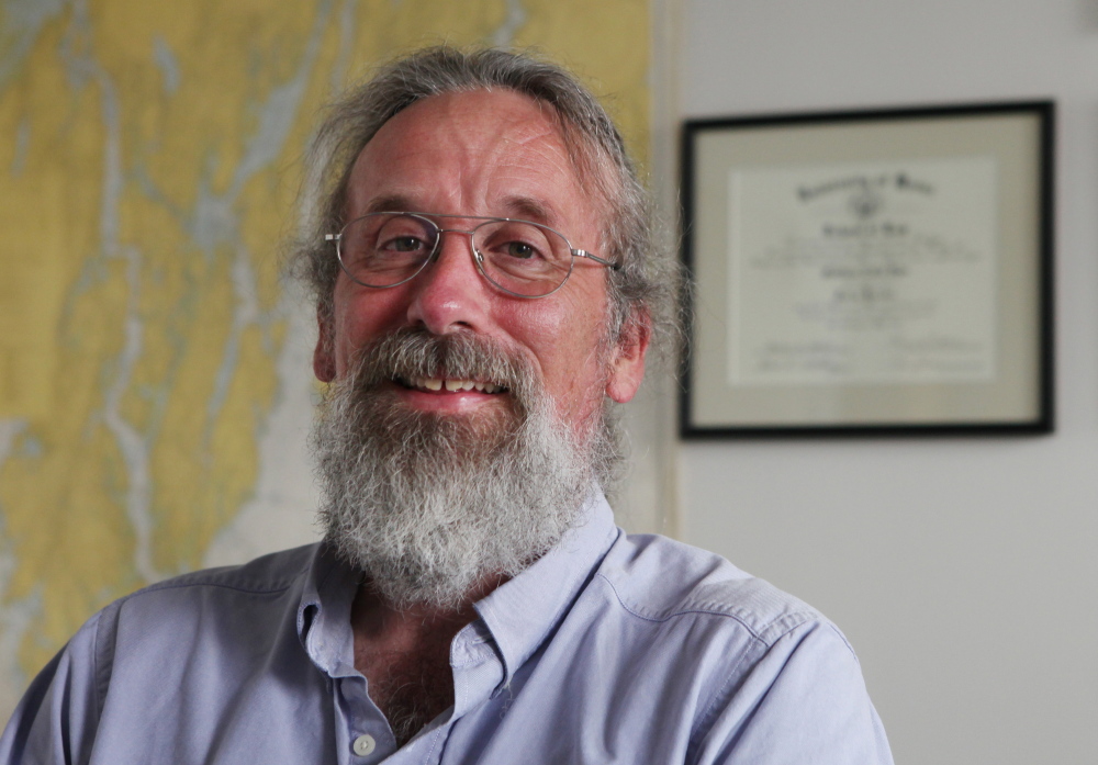 Matt Dyer poses Friday, July 25, 2014 in his office in Lewiston, Maine. Last year, Dyer was attacked by a polar bear while on a trip to Canada.