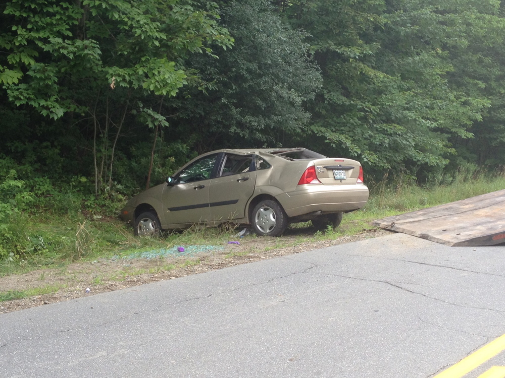 A 17-year-old girl was taken to the hospital after her car, seen here after it was righted, rolled over on Alder Park Road in China Tuesday afternoon.
