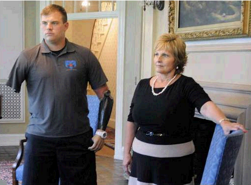 First lady Ann LePage and Travis Mills .Staff photo by Andy Molloy