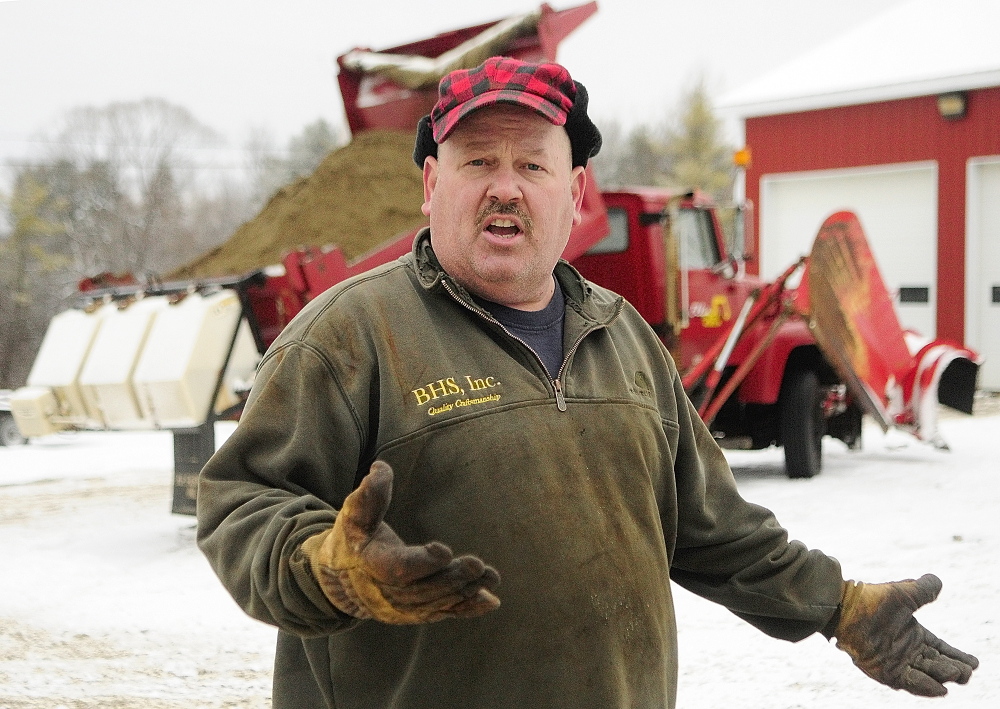 Chris Ellis talks about the calcium chloride dispensers on his plow trucks in December at Ellis Construction in Farmingdale. Ellis and the town agreed Wednesday to end the plow contract two years early.