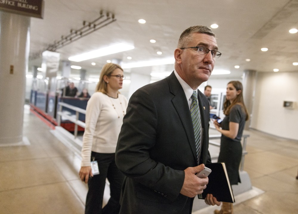 Sen. John Walsh, D-Mont., entering the Senate chamber on Capitol Hill in Washington.