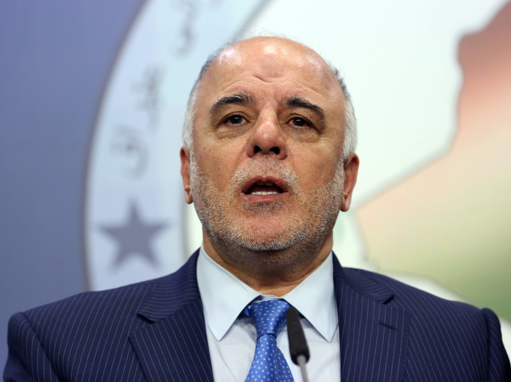 In this Tuesday, July 15, 2014 file photo, Shiite lawmaker and Deputy Parliament Speaker Haider al-Ibadi speaks to the media after an Iraqi parliament session in Baghdad.