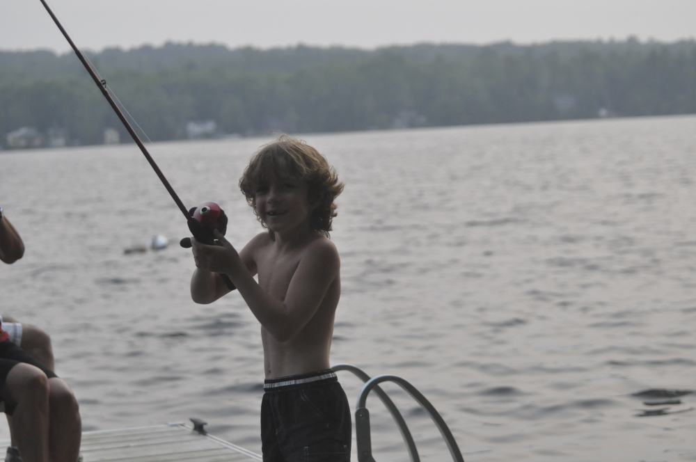 Photo by Zuzu Johnson 
 Giacomo Johnson of Skowhegan fishes on Wesserunsett Lake recently.