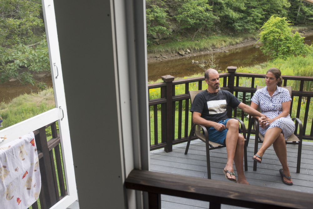 Portland Press Herald staff photo by Logan Werlinger 
 CAPE NEDDICK, ME - AUGUST 12: Cory McGowan and Erin Haye sit at their father Paul McGowan’s house on Tuesda. The brother and sister are dealing with their father’s suicide and doing their part to see that people feel open to talking about depression and suicide so it doesn’t happen to someone else’s loved one.