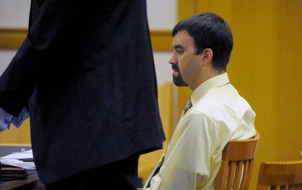 Andrew Maderios makes his initial appearance in Somerset County Superior Court in Skowhegan on Wednesday. Maderios’ attorney, Leonard Sharon, stands by his side.