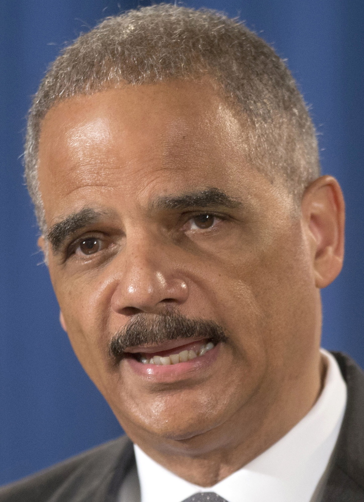 FILE - This July 14, 2014 file photo shows Attorney General Eric Holder speaking at the Justice Department in Washington. Holder cautioned against the use of data in sentencing criminal defendants, saying judges should base punishment on the facts of a crime rather than on statistical predictions of future behavior that can be unfair to minorities. (AP Photo/Pablo Martinez Monsivais, File)