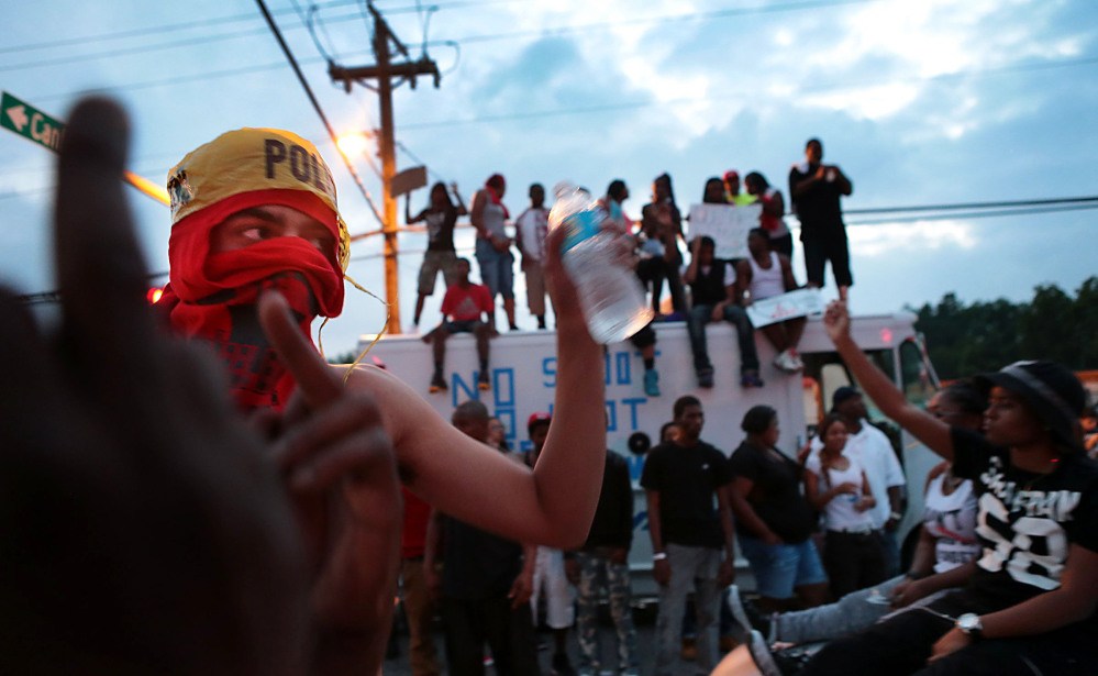 Protestors gather in Ferguson, Mo., Sunday.