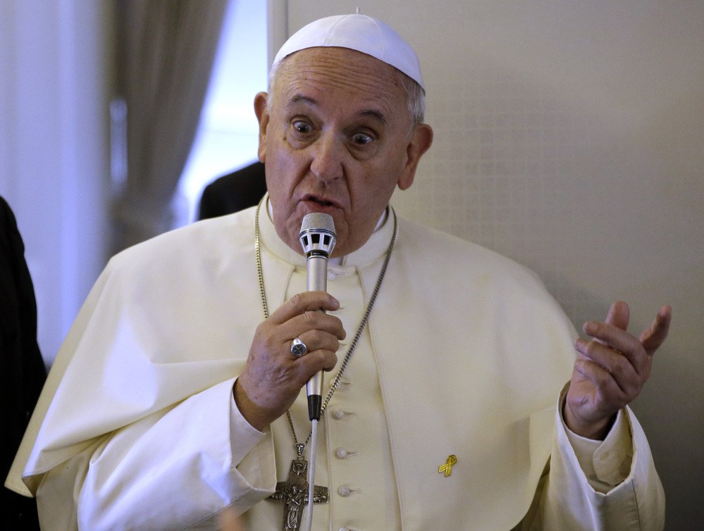The Associated Press
Pope Francis speaks to the media during an airborne news conference on his journey back to Rome from Seoul, South Korea on Monday.