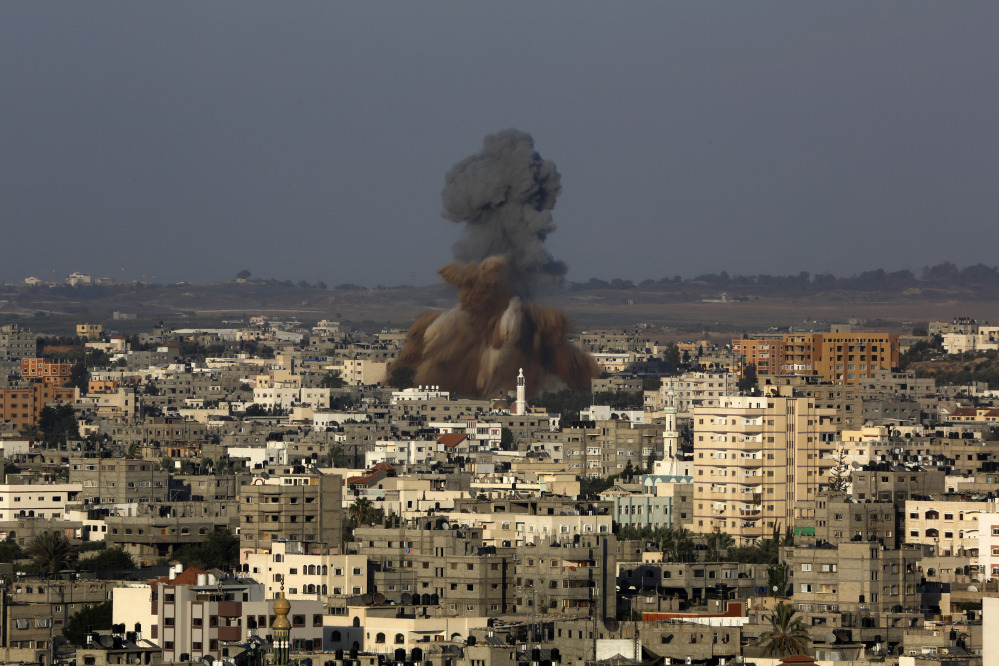 Smoke and debris rise after an Israeli strike hit Gaza City on Tuesday. The Israeli military said it carried out a series of airstrikes across the Gaza Strip in response to renewed rocket fire. The burst of violence broke a cease-fire and endangered negotiations aimed at ending the month-long war between Israel and Hamas.