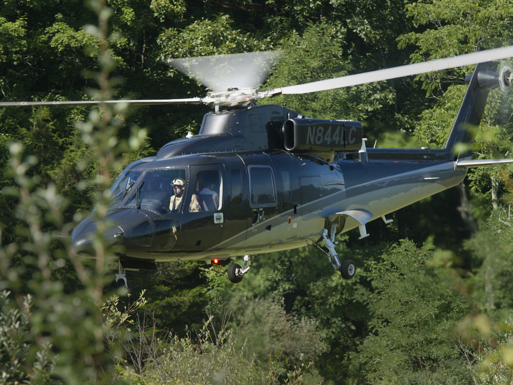 A search helicopter lands close to where an Air Force F-15C fighter jet based in Massachusetts crashed near Deerfield, Va., on Wednesday.