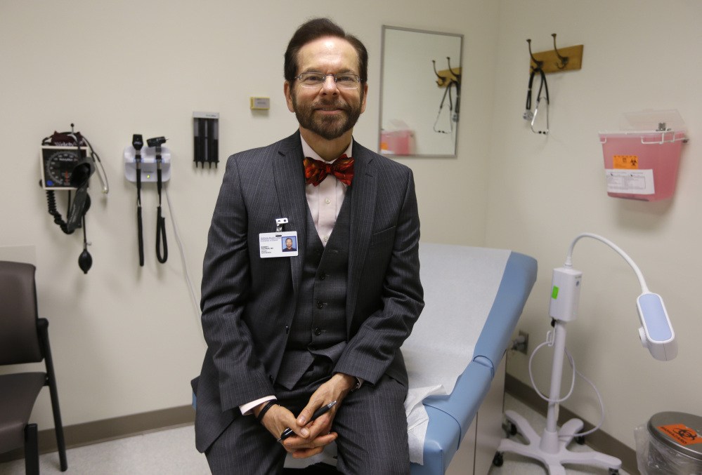 Dr. Robert Palinkas, director of the McKinley Health Center at the University of Illinois, stands in an exam room in Urbana, Ill. Extra health checks are part of protocols campuses throughout the United States have in place as they prepare for as many as 10,000 students from Nigeria, Guinea, Liberia and Sierra Leone, where more than 1,000 people have died in the worst Ebola outbreak in history.