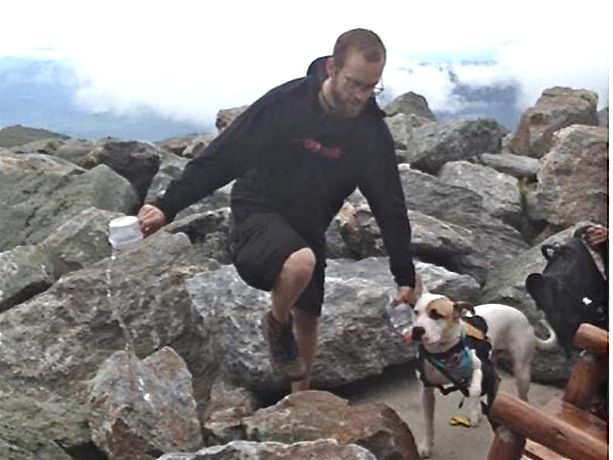 Police distributed this photo of the pit bull suspected in the attack, and its owner.