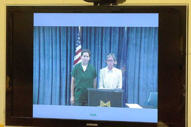 Staff file photo by Michael G. SeamansBethMarie Retamozzo, left, stands with attorney Lisa Whittier during arraignment in Waterville District Court in 2013.