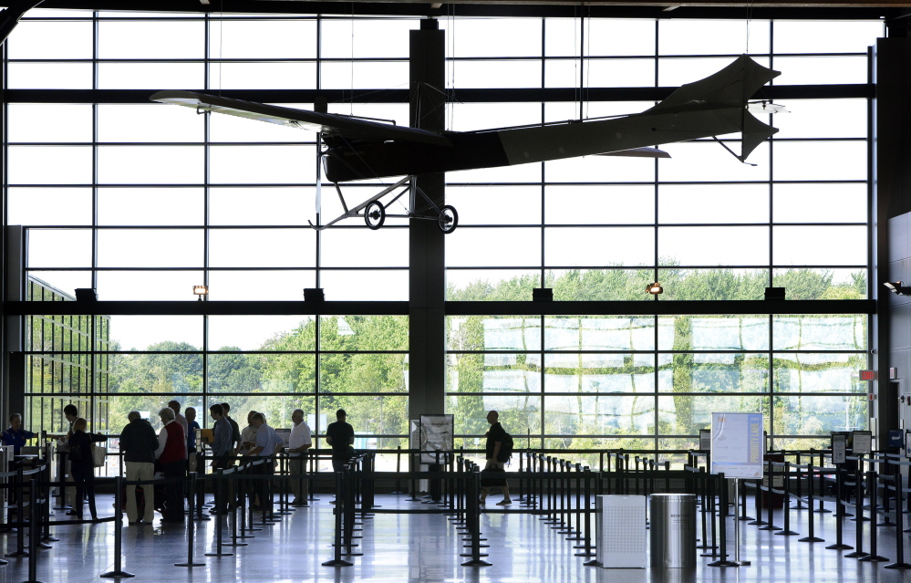 Travelers wait in a Transportation Security Adminstration screening line Tuesday at Portland International Jetport.