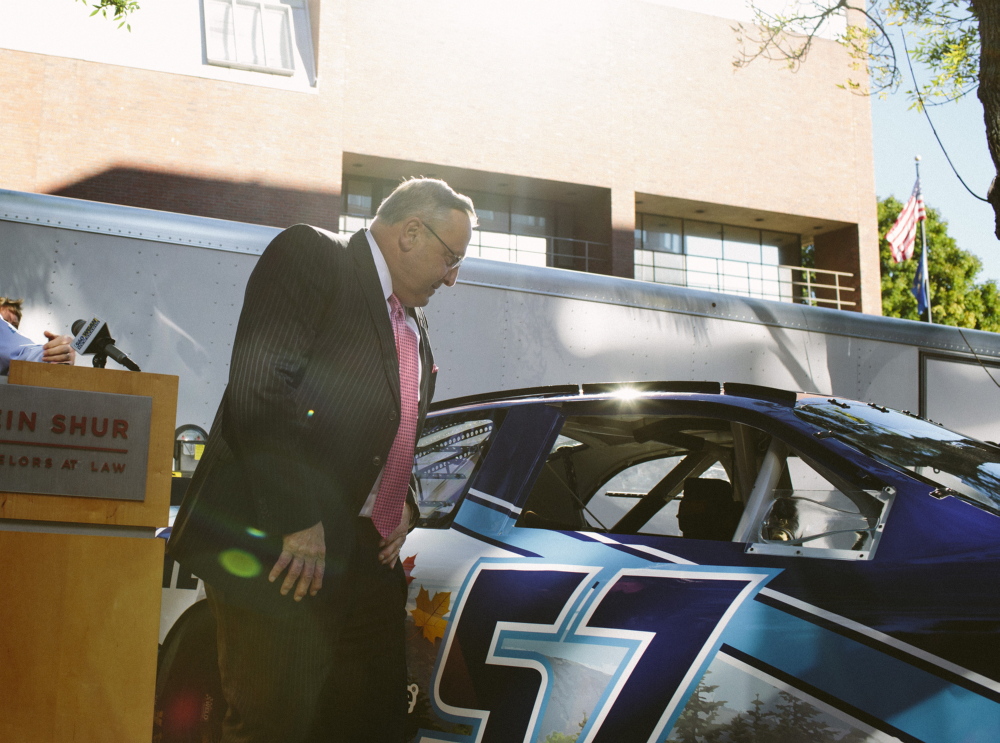 PORTLAND, ME - SEPTEMBER 12:  Maine Governor Paul LePage examines the model of NASCAR driver Austin Theriault's stock car in Portland, ME on Friday, September 12, 2014. The "Maine Car," which is the first public-private sponsored car, was unveiled during a press conference where LePage spoke. Photo by Whitney Hayward/Staff Photographer)