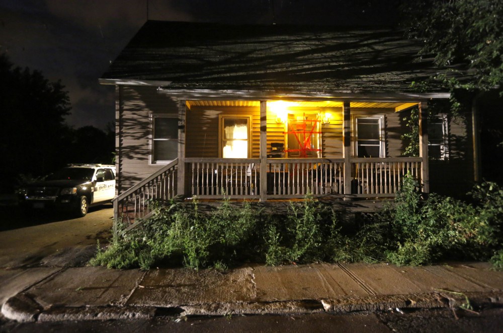 A Blackstone, Mass. police vehicle sits next to a house where a Massachusetts prosecutor said the bodies of three infants were found in Blackstone. Worcester County District Attorney Joseph Early Jr. said authorities don’t know when or how the babies died.