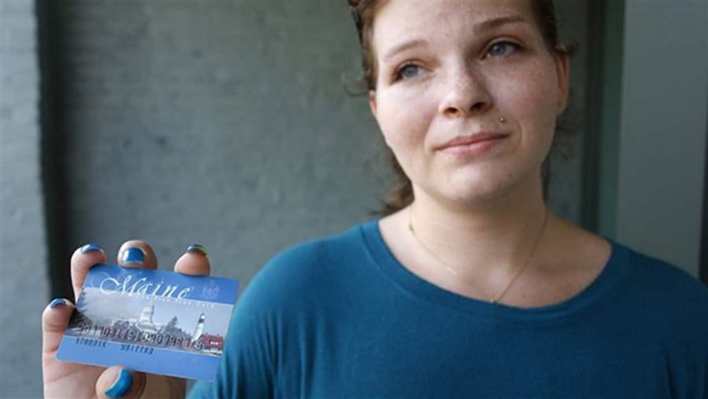 Stormie Whitten, 25, shows her Maine EBT card after shopping for groceries.
Portland Press Herald photo
