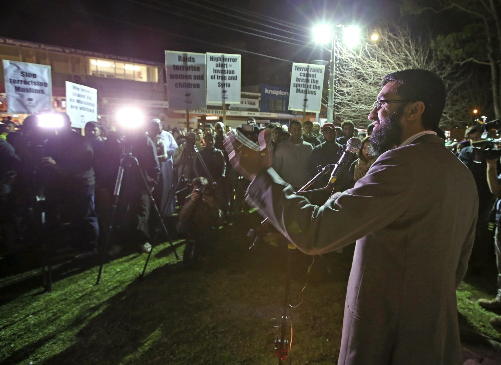 Members of a Muslim community gather for a peaceful demonstration at Lakemba in suburban Sydney following raids involving 800 federal and state police officers that came in response to intelligence that an Islamic State group leader in the Middle East was calling on Australian supporters to kill in Sydney, on Thursday.