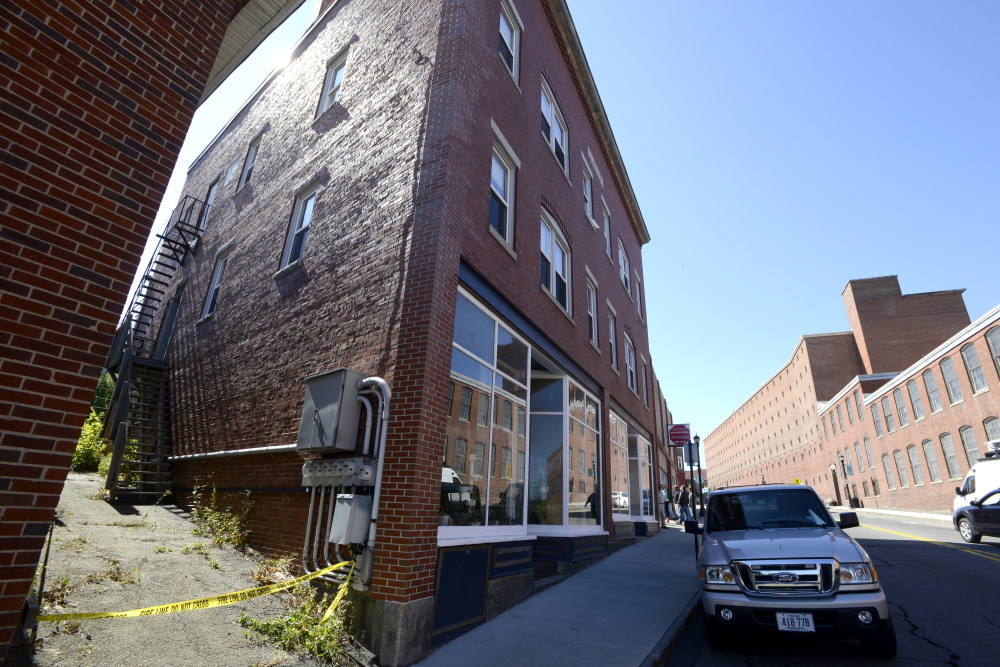 Crime scene tape blocks an alley Friday at 35 Main St. in Biddeford after an arsonist set fire to the complex Thursday.