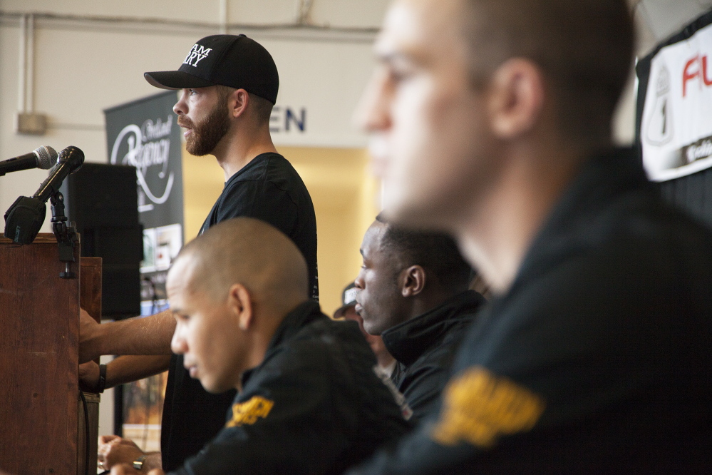 Brandon Berry speaks, while Russell Lamour Jr., Jorge Abiague and Jason Quirk watch, during a press conference Monday announcing a fight card on Nov. 15.