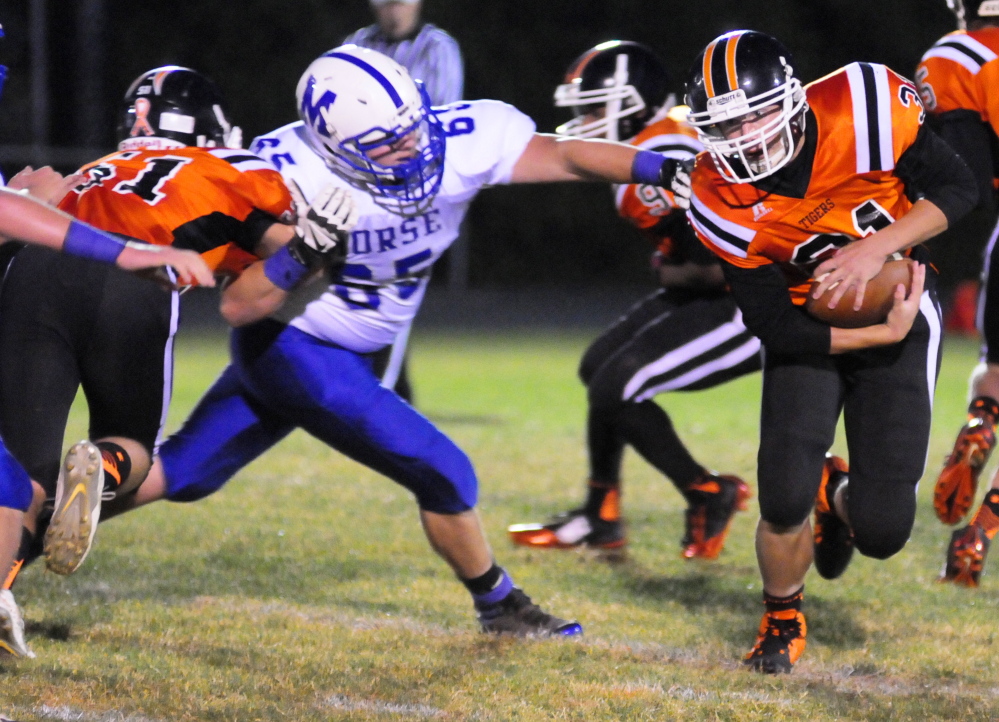 Staff photo by Joe Phelan 
 Gardiner offensive lineman Adrian Heath, left, blocks Morse defensive tackle Andrew Plummer to free up  Wyatt Blair during a game Friday at Hoch Field in Gardiner.