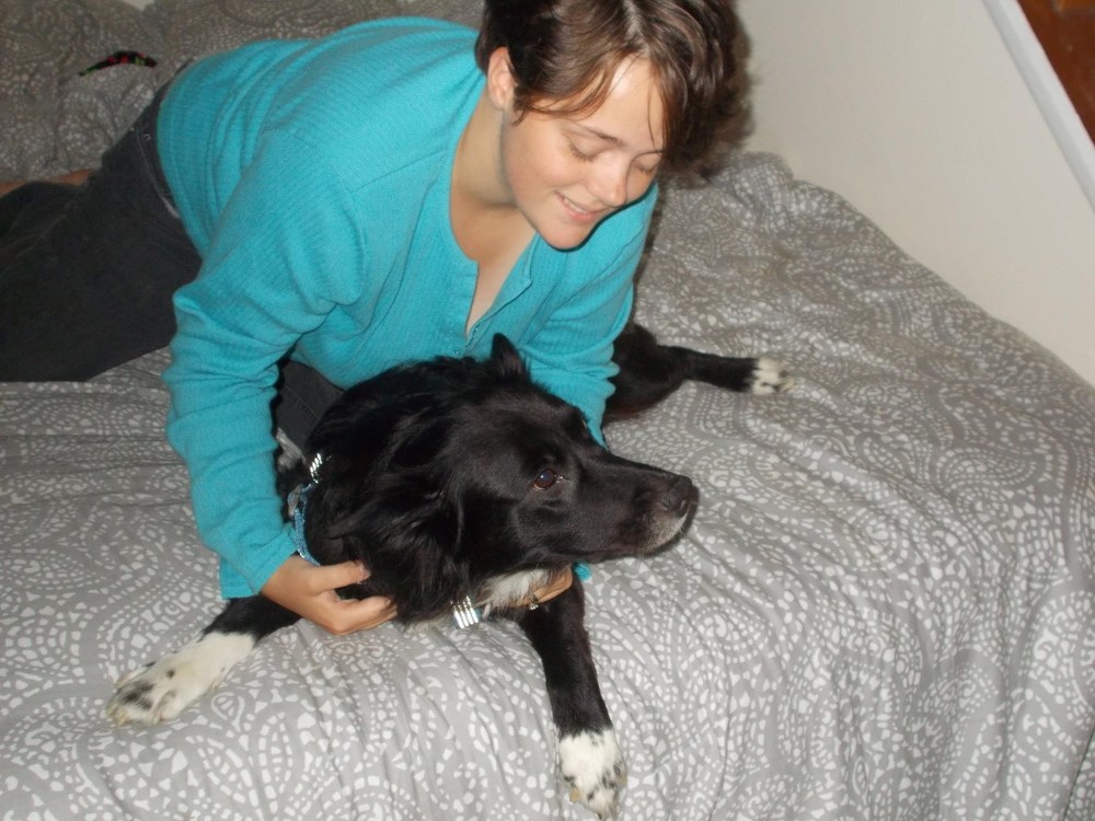 Kerstie Bush, 19, of Bangor, plays with her dog, Running Bear. The dog had been lost for a month before turning up at the Somerset Humane Society in Skowhegan. Kerstie and Running Bear both cried when they were reunited.