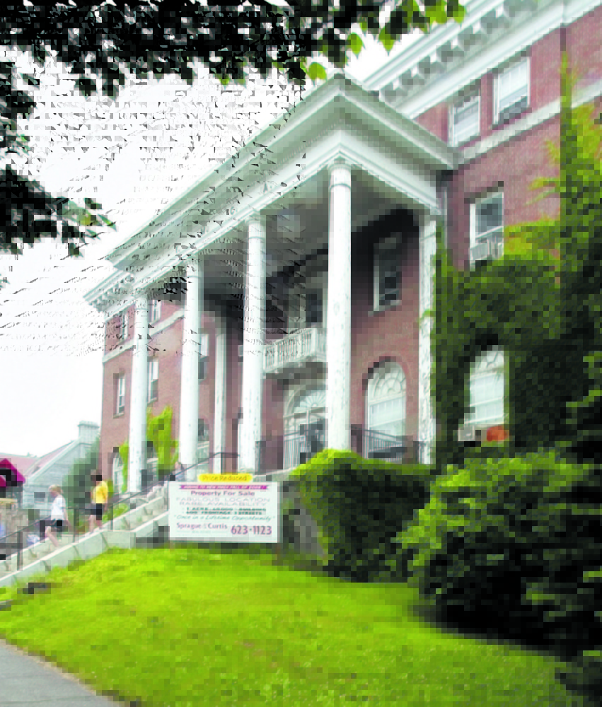 Lithgow Public Library is seen in the background behind the old Kennebec Valley YMCA building on Winthrop Street. The Y moved to Union Street in 2006 and Lithgow supporters were asked to hold off on library renovation fundraisers while the effort to build the new Y was underway. Now the Y is repaying the favor.