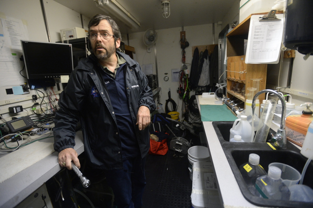 Senior Research Scientist William Balch of Bigelow Laboratory for Ocean Sciences inside his truck as he waits to board the Nova Star. Balch uses the Nova Star to study the distribution of phytoplankton in space and time.