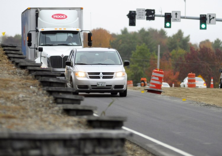 Vehicles head east on Tuesday toward the intersection of Smith Street and Western Avenue in Augusta. Residents expressed concern about not being able to see approaching traffic when they pull out of Smith Street onto Western Avenue.