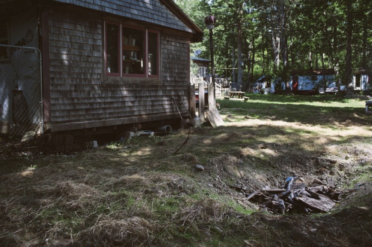 After Maine State Police received a tip, police dogs and eventually an excavator were used to determine whether Charles Woodburn was buried on the property at 219 Neck Road in Jefferson. His remains were found on Aug. 27. Whitney Hayward/Staff Photographer