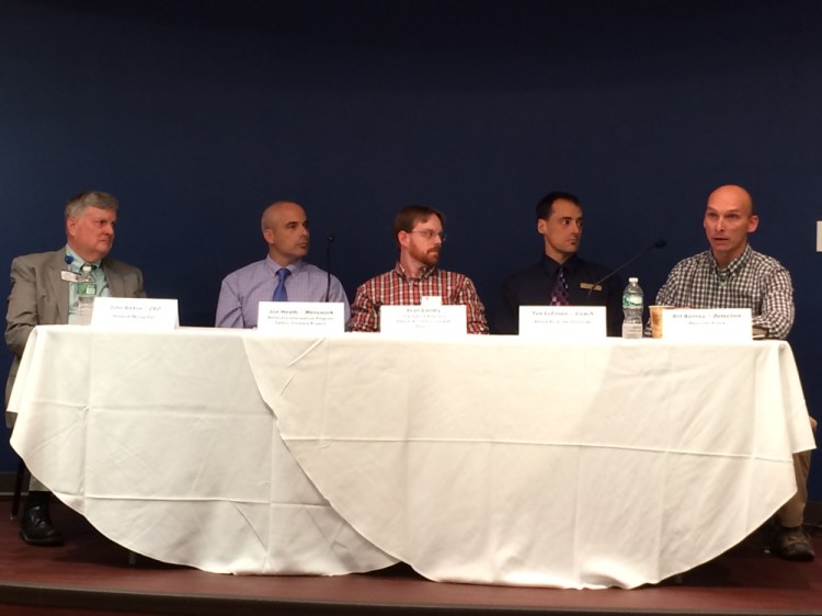 William Bonney, a Waterville police detective, far right, speaks as part of a panel discussion on domestic violence Wednesday at Thomas College in Waterville. Other panel members include, from left, John Dalton, CEO of Inland Hospital; Jon Heath, of the Family Violence Project; Sean Landry, of Sexual Assault Crisis and Support; and Tim LeCrone, a coach and operations manager at the Alfond Youth Center.