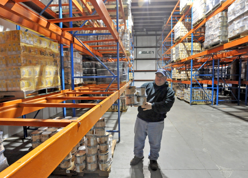 Todd Parker, shipping and receiving manager at Gifford’s Ice Cream manufacturing plant in Skowhegan, holds a package of chocolate ice cream ready to ship on Thursday. Gifford’s Ice Cream recently was honored as the maker of the best chocolate ice cream entered in a contest conducted by a Wisconsin trade group.