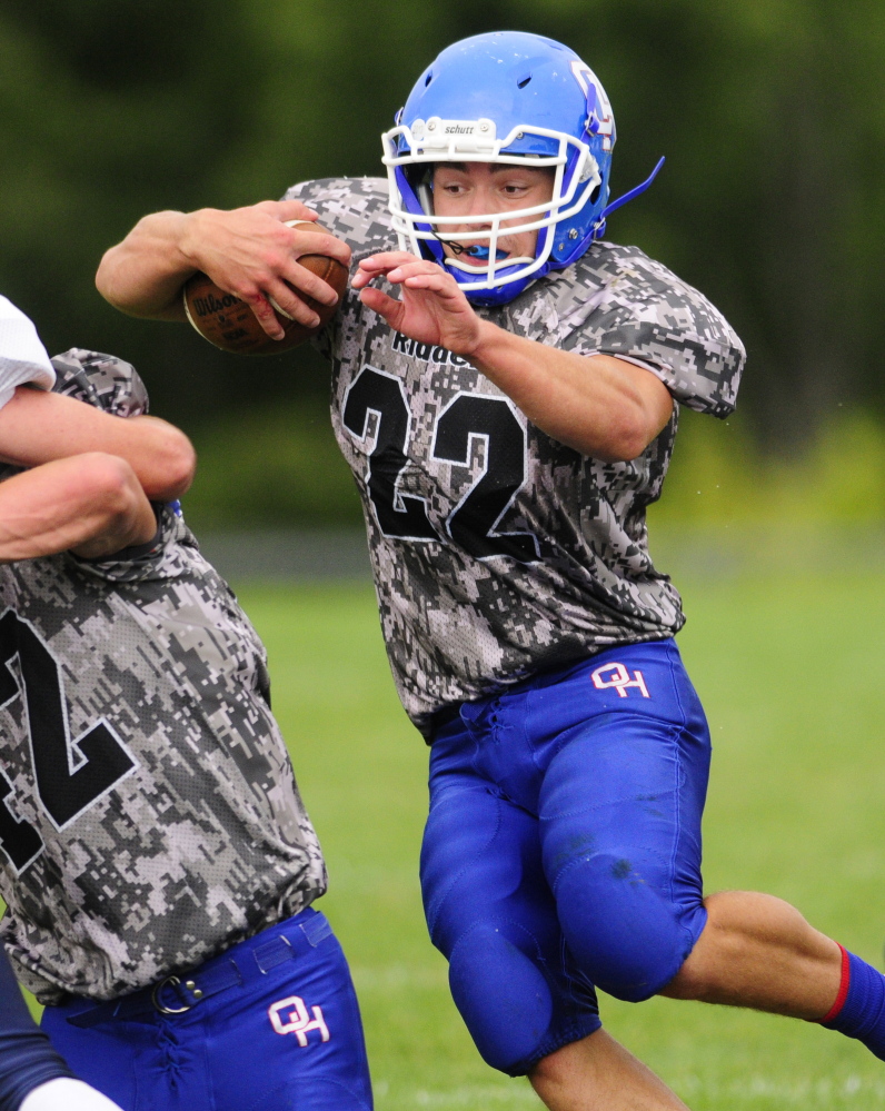 Staff file photo by Joe Phelan 
 Oak Hill running back Alex Mace picks up yardage in a Sept. 13 game against Dirigo. Mace and the Raiders host Old Orchard Beach on Saturday in a key Western D Campbell Conference game.