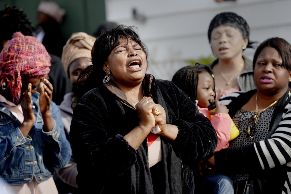 Ana Mavungo sings during a memorial last Thursday for her friend Laudrinha Kubeloso, who was struck and killed by a hit-and-run vehicle Sept. 23. Kubeloso’s former fiance, Evaristo Deus, is being held on a charge of murder in her death.