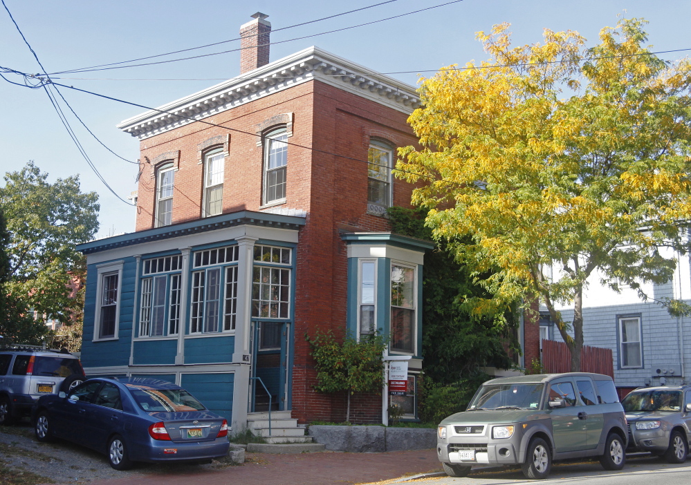 Owners of this home at 147 Congress St. on Munjoy Hill in Portland are asking to make it a historic landmark to protect it from ruin.