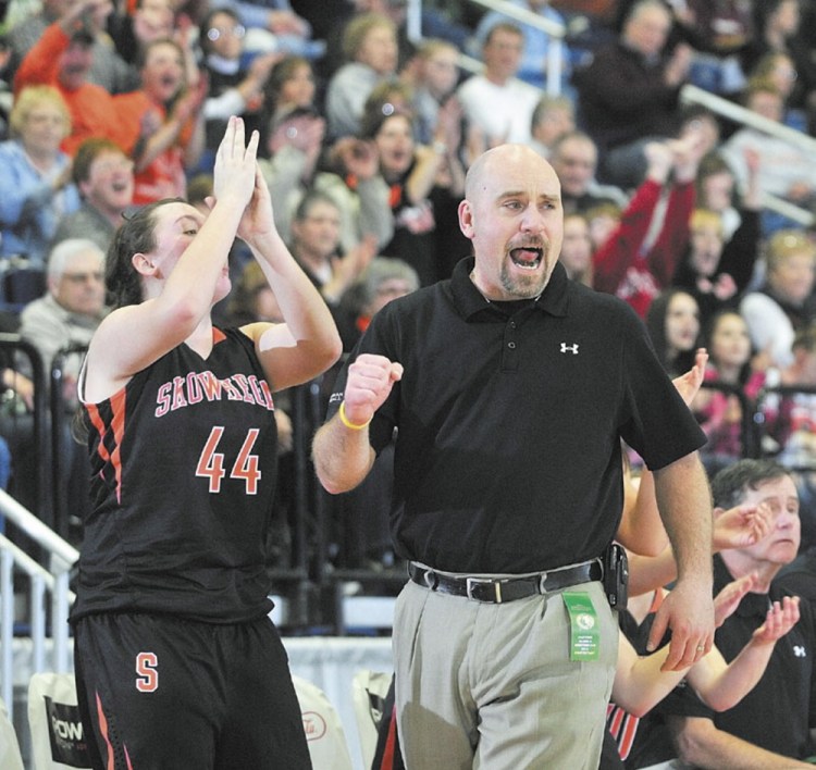 Staff file photo by Joe Phelan 
 Former Skowhegan girls basketball coach Heath Cowan celebrates during a 2012 Eastern A tournament game. Cowanreturns to the sidelines this season to coach Mt. Abram boys.